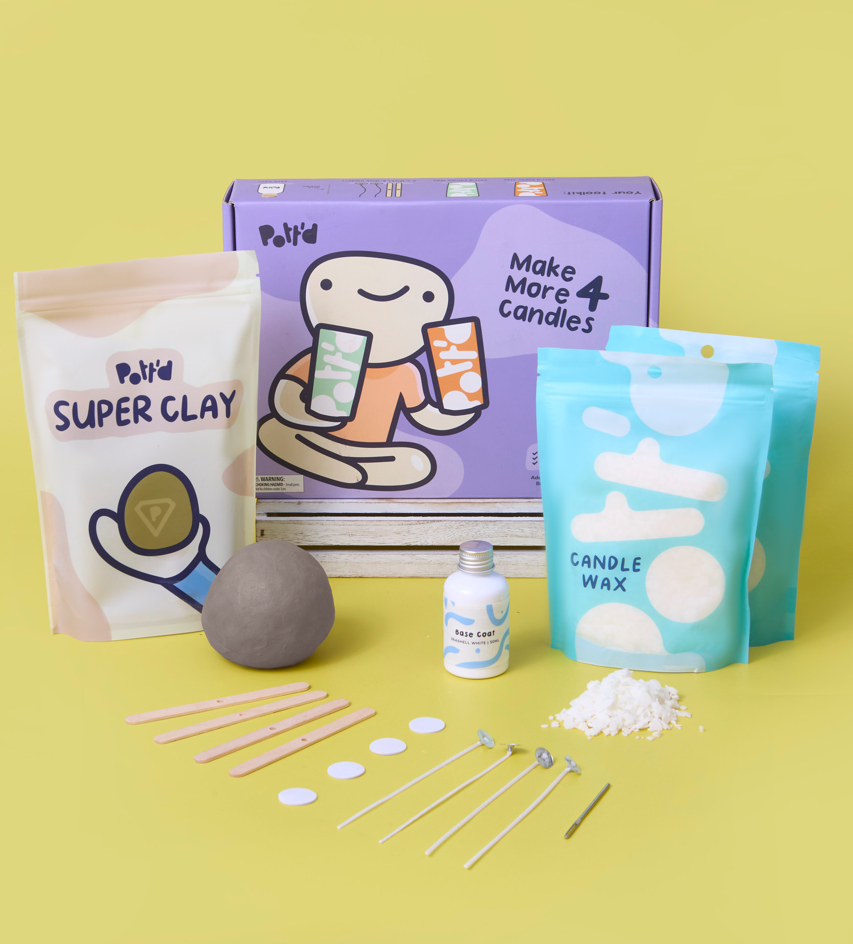 Candle making kit with pastel packaging and materials on a yellow background, including clay, wax, and tools.