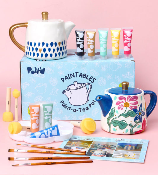 Rolling pin kit with smooth wooden handles on a pink background, featuring playful packaging with cartoon art.