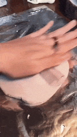 GIF of someone moulding and shaping clay