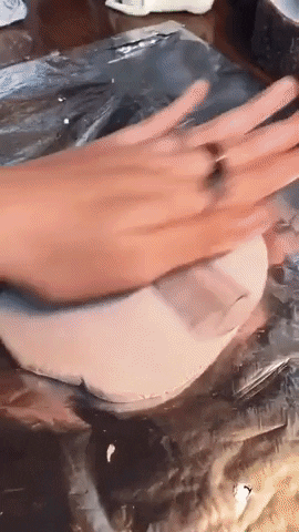 GIF of someone cutting and moulding clay 